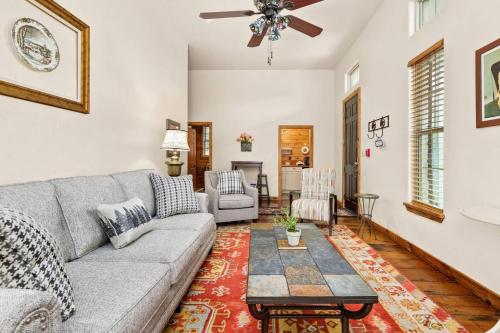 a living room with a couch and a table at #24 at Gruene Silo Inn in New Braunfels