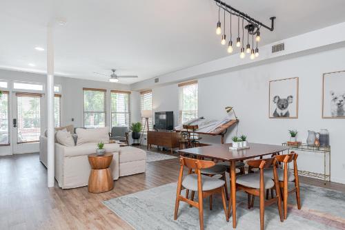 a living room with a table and a couch at Ybor City Gem I Steps to 7th Ave I Sleeps 6 in Tampa