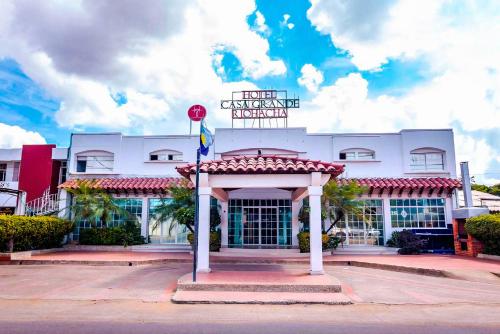 a hotel entrance with a gazebo in front of a building at Hotel Casa Grande Riohacha Inn in R&iacute;ohacha