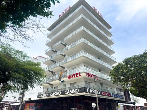 a hotel on the corner of a street at Hotel Marco Polo Rodadero in Santa Marta