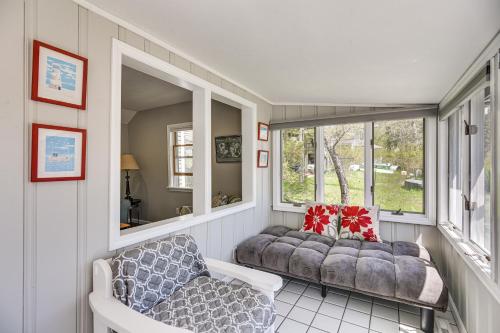 a room with two chairs and a couch and a window at Cottage on Private Pond with Beach in Wareham in Wareham