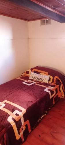 A bed or beds in a room at Los Amigos