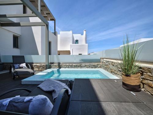 a swimming pool in the middle of a house at Paros Gem in Naousa