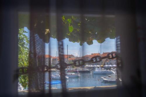 a view of a marina with boats in the water at Apartment Sidro in Postira
