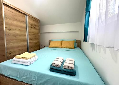 En eller flere senge i et værelse på D&A Apartments