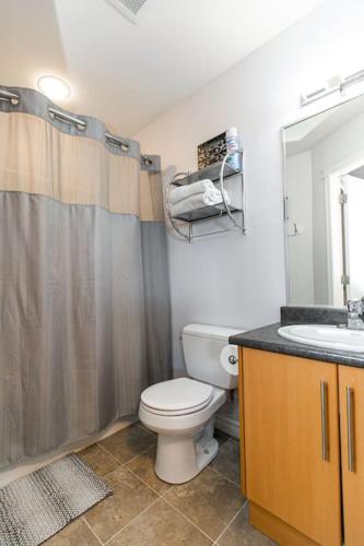 a bathroom with a toilet and a sink at Super wow view! in Victoria