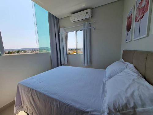 Ένα ή περισσότερα κρεβάτια σε δωμάτιο στο Apt401 central,4ºand/n tem elevador, 3 quartos