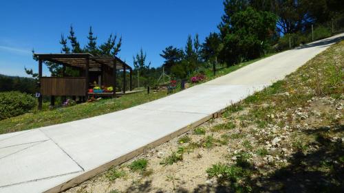 a road with a gazebo on the side of a hill at Casalmar Pupuya in Pupuya