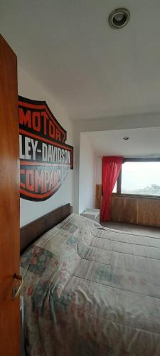 Posteľ alebo postele v izbe v ubytovaní Motorcycle fin del mundo