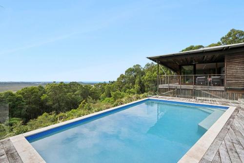 a swimming pool on top of a house at Coolum Scenic Getaway - Mountain & Ocean views only 15 minutes from the beach in Yandina Creek