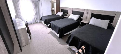 Postel nebo postele na pokoji v ubytování Hotel Plaza Formosa