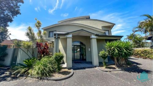 a house with a round roof at Beachside Beauty in Caves Beach