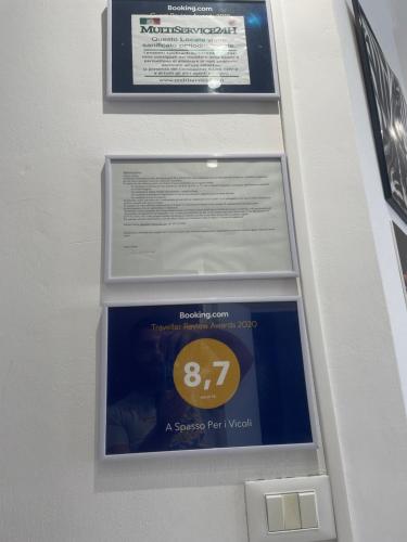 a sign in a elevator with a speed limit sign at Living Genova Apartment in Genova