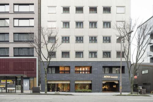 a large white building with many windows at Minn Kanazawa in Kanazawa