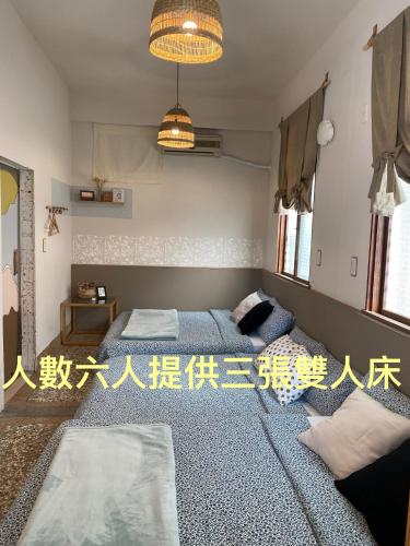 Postel nebo postele na pokoji v ubytování 巴摩蘇蘿 Bramasole 包層民宿