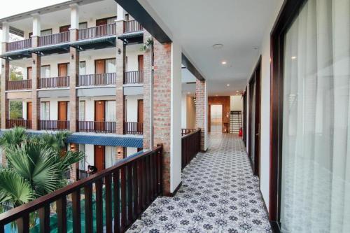 a corridor of an apartment building with a balcony at Sea Angel HOTEL Tuần Châu Hạ Long in Ha Long