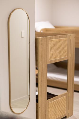 a mirror next to a bunk bed in a room at Seahaven Resort in Townsville
