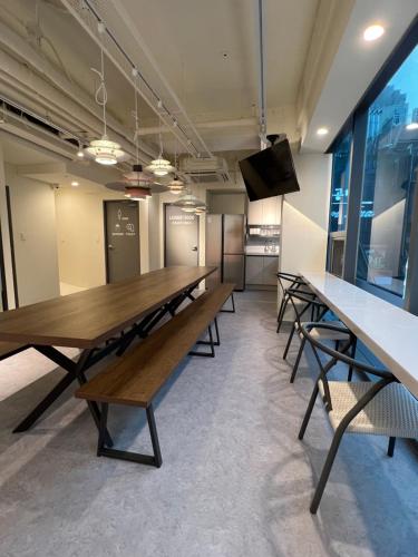 a conference room with a long table and benches at Seoul Cube Jongro in Seoul