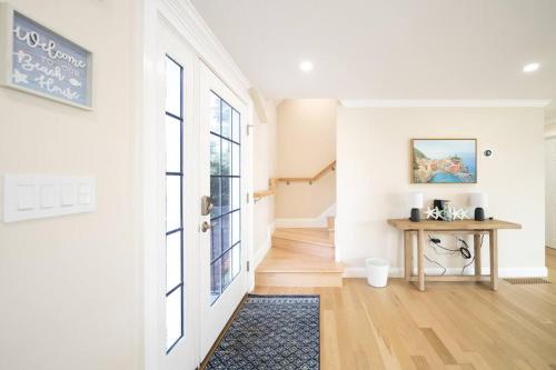 a living room with a table and a window at 40 - 4BR Lakeview - Lakeside retreat near GJK View in Yarmouth