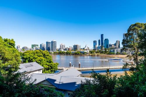 a view of a city with a river and buildings at Skyline and Riverview 2 bedrooms apartment in Brisbane