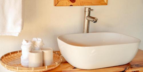 a bathroom with a sink and towels on a counter at Muong Hoa Eco Villa in Sa Pa