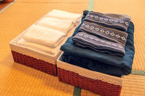 a pile of towels sitting on top of a table at Fuji Yamanakako Resort Hotel - Vacation STAY 03076v in Yamanakako