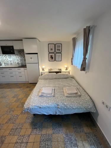 a bedroom with a large bed in a room at kisapartman in Fonyód