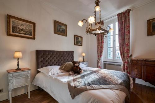 Ένα ή περισσότερα κρεβάτια σε δωμάτιο στο La Casa Consuelo ~ Piscine ~ Jardin ~ Centre ville