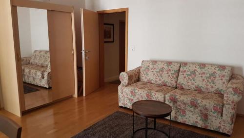 a living room with a couch and a table at Gästehaus Luise in Bad Bergzabern