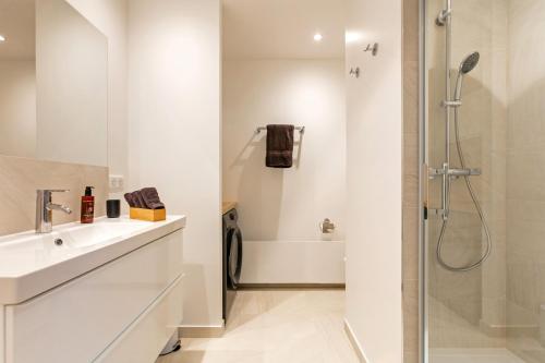 Koupelna v ubytování Comfortion Norma - Suite de luxe avec vue sur la Tour Eiffel
