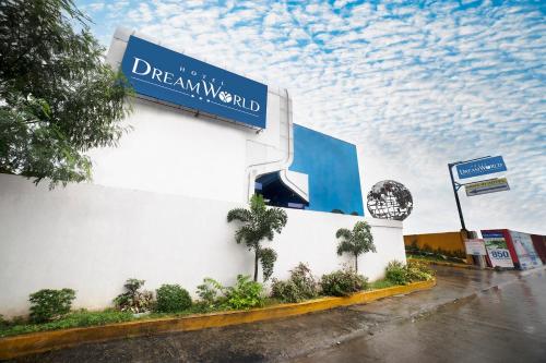 a sign on the side of a building at Hotel Dreamworld Las Pinas in Manila