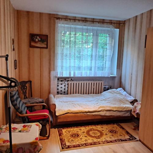 Ένα ή περισσότερα κρεβάτια σε δωμάτιο στο Apartament WENDY