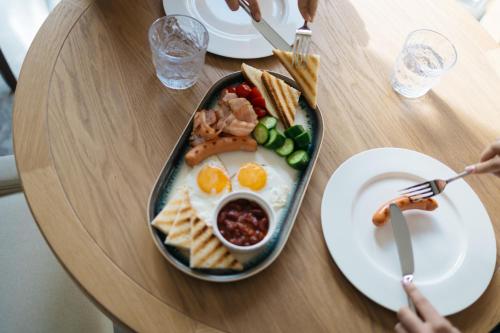 a table with a tray of breakfast food on it at Old Ijevan Boutique Hotel in Ijevan