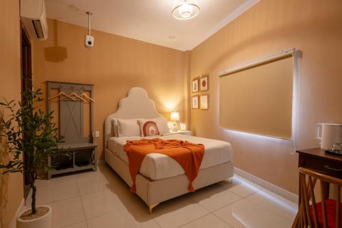 Ένα ή περισσότερα κρεβάτια σε δωμάτιο στο AMILA NGUYEN HUE HOTEL by SAZI