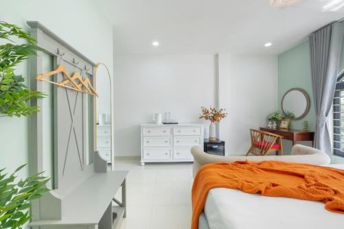 Ένα ή περισσότερα κρεβάτια σε δωμάτιο στο AMILA NGUYEN HUE HOTEL by SAZI