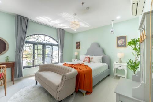 Ένα ή περισσότερα κρεβάτια σε δωμάτιο στο AMILA NGUYEN HUE HOTEL by SAZI