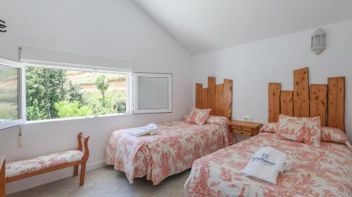 Un pat sau paturi într-o cameră la Casa Huerta El Fontanarillo Montemayor by Ruralidays