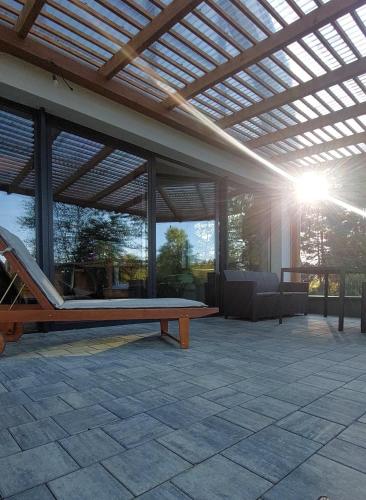 a pavilion with a ping pong table in a patio at Lawendowa Stodoła in AdamÃ³w