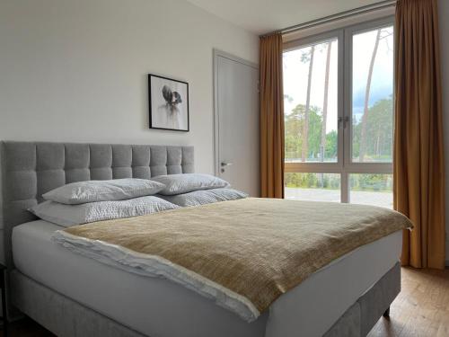 Llit o llits en una habitació de My Marina Apartment mit Pool und Sauna am See