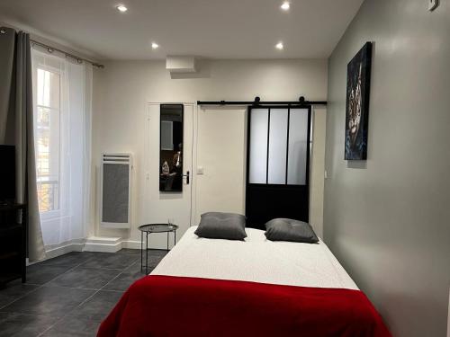 Ein Bett oder Betten in einem Zimmer der Unterkunft Appartement Paris - La Defense