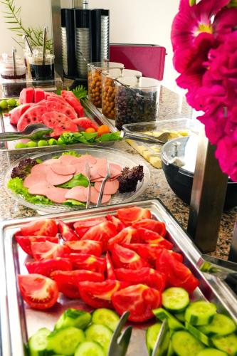 a buffet of fruits and vegetables on a table at HOTEL DALYANCE in Dalyan