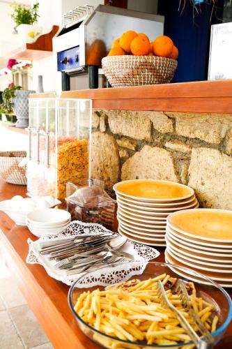 a buffet with plates and bowls of food on a table at HOTEL DALYANCE in Dalyan