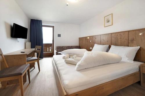 Un pat sau paturi într-o cameră la Residence Condor