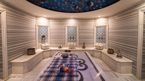 a room with a bath tub in a room at Babylon Rotana Hotel in Baghdad