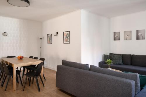 a living room with a couch and a table at LeoApart in Wrocław