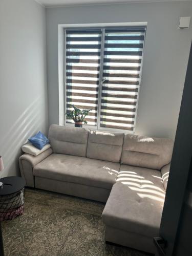 a living room with a couch and a window at Akihabara 1 in Loo