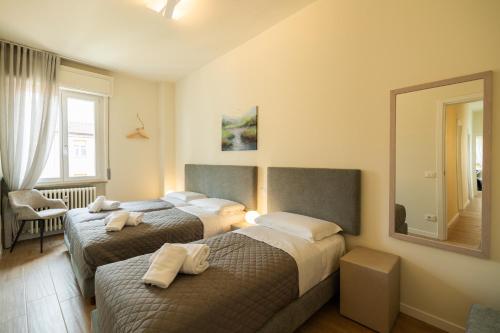 Ένα ή περισσότερα κρεβάτια σε δωμάτιο στο Domus Verona - Ampia residenza Filippini a pochi passi dall'Arena