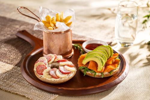 a plate of food with a sandwich and french fries at Sanhe Daoli Resort in Qingyuan
