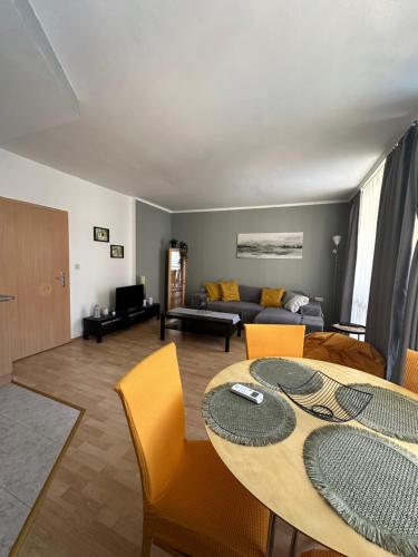 a living room with a table and a couch at Complex Sands Holiday Apartments in Sunny Beach