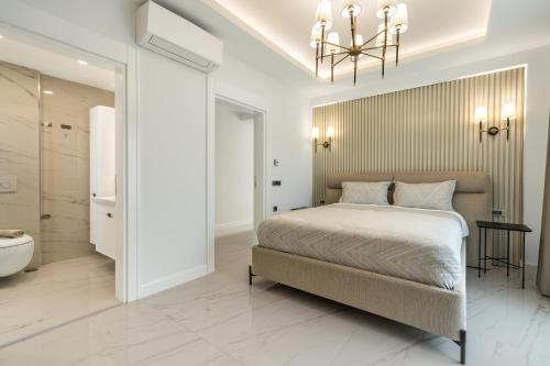 a bedroom with a large bed and a bathroom at Edem Villa Diamond in Kemer